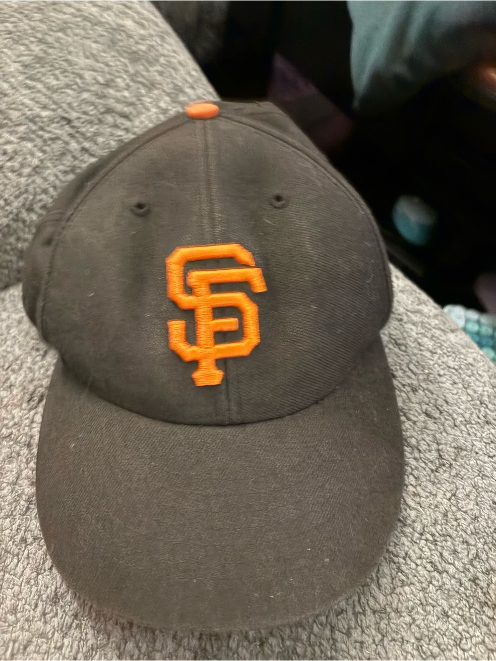 Genuine Merchandise Black Cap with Orange Logo
